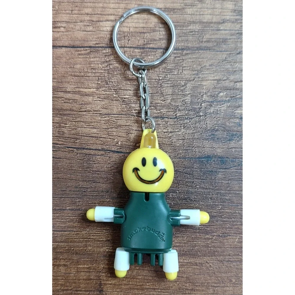 SMOKEBUDDY Keychain Green Plastic Smoke Buddy Poseable Happy Smiley Face B16